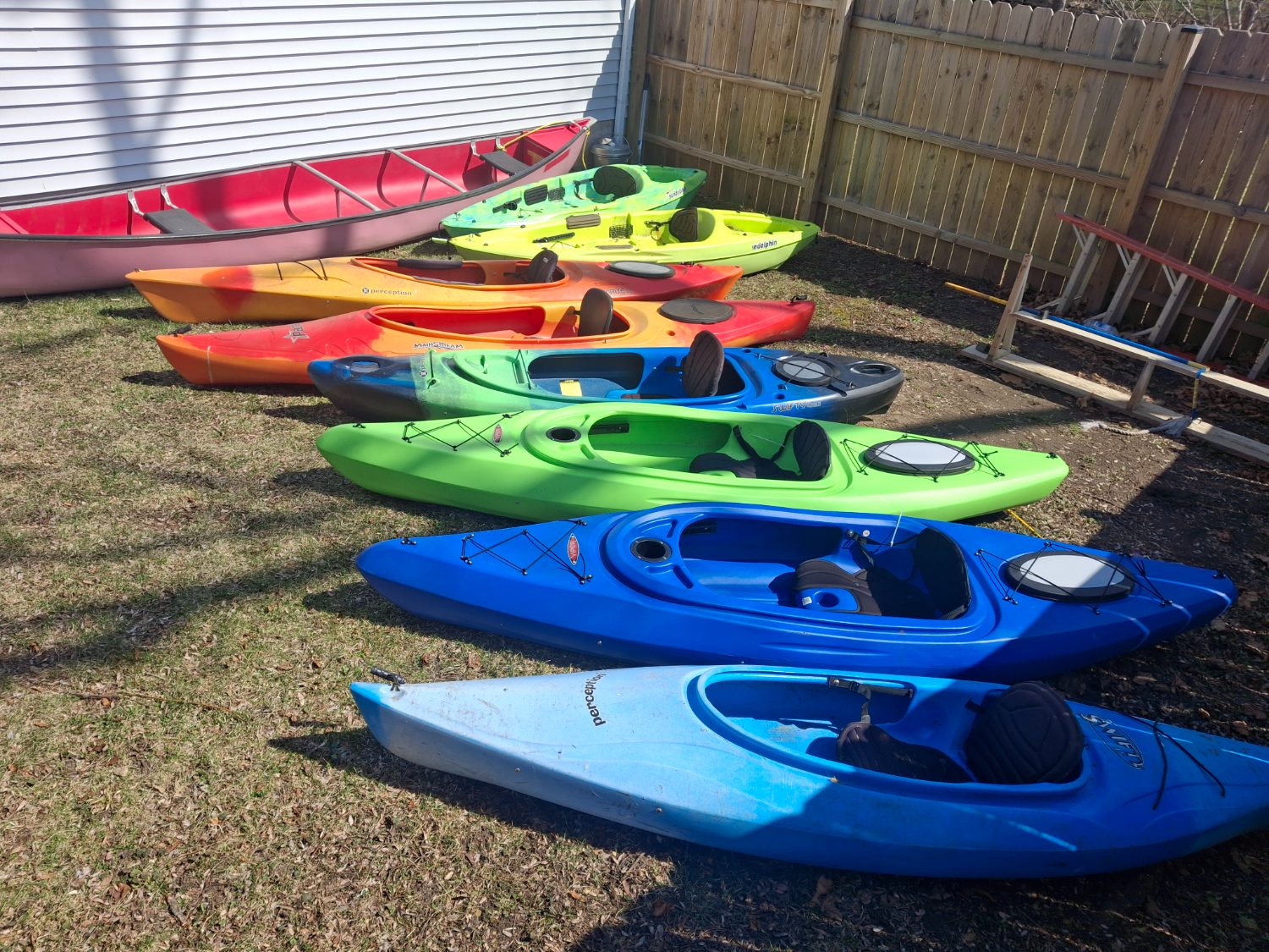 Our colorful fleet of kayaks & canoes